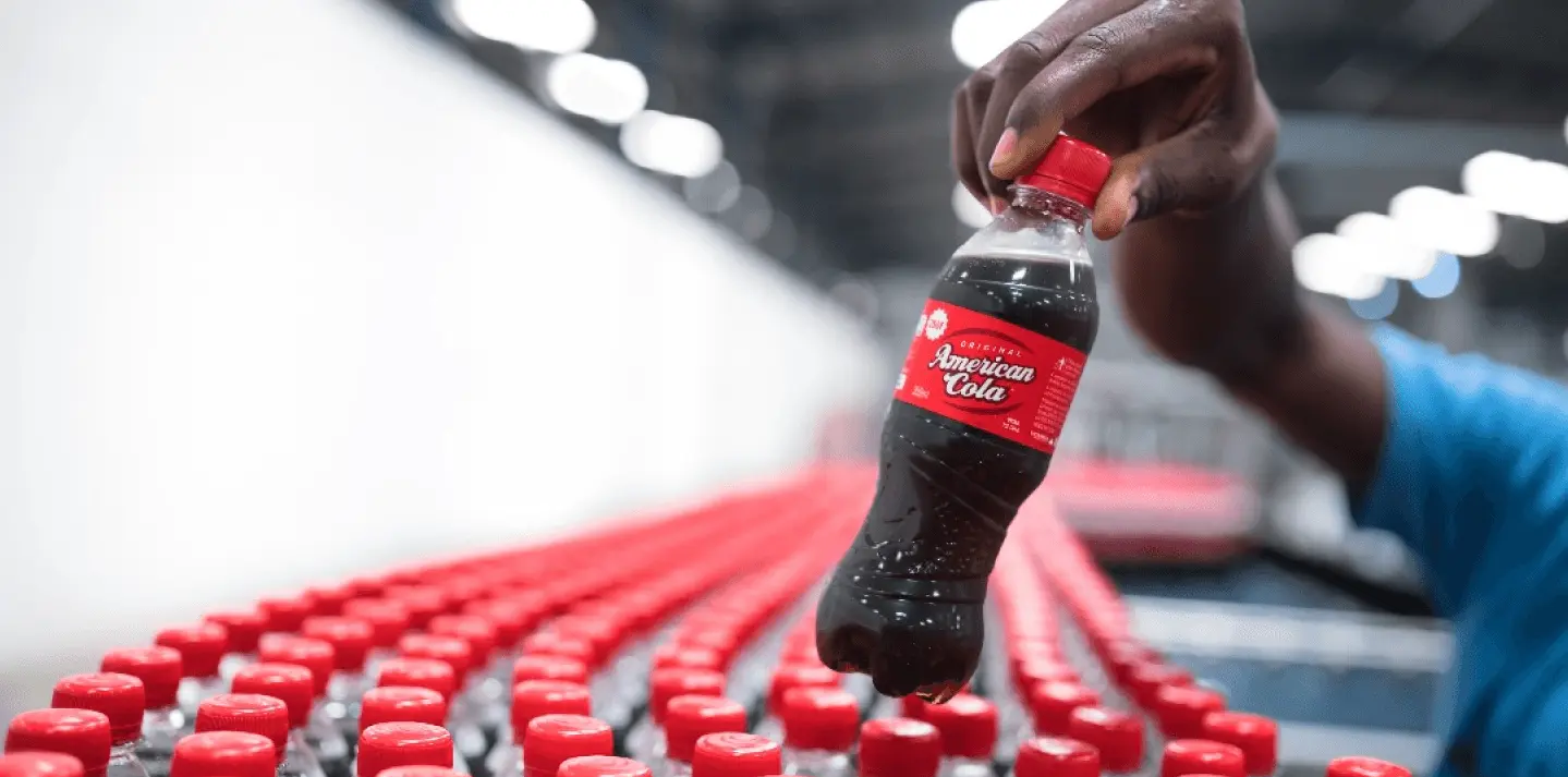 hand holding american cola